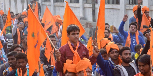 Indian activists of Hindu Bajrang Dal, along with Vishva Hindu Parishad (VHP) organizations, raise religious slogans during a procession marking the 23rd anniversary of the demolition of the Babri Masjid Mosque in Ayodhya, in Amritsar on December 6, 2015. Hindu hardliners demolished the Babri Mosque on December 6, 1992, claiming it was built on the site of the birth place of the Hindu God Ram, sparking off country wide Hindu-Muslim riots. AFP PHOTO / NARINDER NANU / AFP / NARINDER NANU (Photo credit should read NARINDER NANU/AFP/Getty Images)