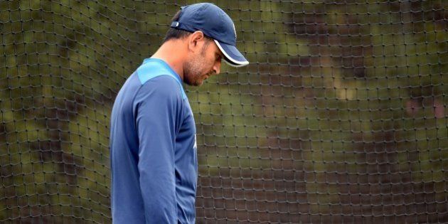 Former Indian captain M.S. Dhoni walks past the nets during cricket training at the Sydney Cricket Ground (SCG) on January 5, 2015. Australia are preparing to take on India in the fourth cricket Test starting on January 6. AFP PHOTO / William WEST --IMAGE RESTRICTED TO EDITORIAL USE - STRICTLY NO COMMERCIAL USE-- (Photo credit should read WILLIAM WEST/AFP/Getty Images)