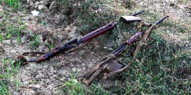 Guns of killed policemen lie on the spot after suspected Maoist rebels detonated a roadside bomb near Tandwa village, in Aurangabad district, Bihar state, India, Tuesday, Dec. 3, 2013. Six police officers and their driver who were patrolling in a vehicle died instantly in the blast, police said. The rebels have been fighting the government for more than four decades, demanding land and jobs for tenant farmers and the poor. (AP Photo)