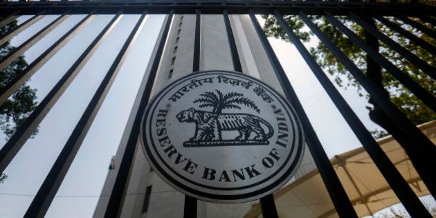 The Reserve Bank of India (RBI) logo is displayed on a gate at the central bank's headquarters in Mumbai, India, on Tuesday, April 1, 2014. Indias central bank left its key interest rate unchanged as consumer-price inflation eased to a two-year low and the rupee strengthened, increasing scope to support growth ahead of national elections starting this month. Photographer: Vivek Prakash/Bloomberg via Getty Images