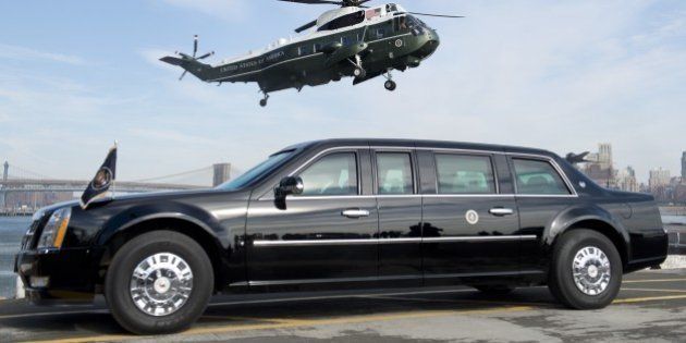 Marine One helicopter, carrying US President Barack Obama, prepares to land next to the Presidential limousine, known as 'The Beast,' at the Wall Street landing zone in New York City, March 11, 2014, prior to attending Democratic fundraisers and stopping at a Gap clothing store to highlight his proposal to raise the federal minimum wage. AFP PHOTO / Saul LOEB (Photo credit should read SAUL LOEB/AFP/Getty Images)