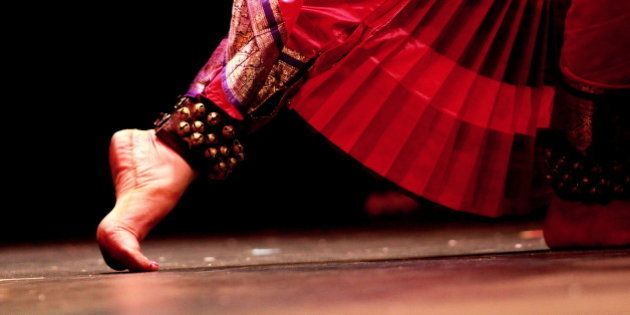 An Indian classical dancer's feet moving during her performance.