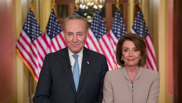 Senate Minority Leader Chuck Schumer of N.Y., and House Speaker Nancy Pelosi of Calif., pose for photographers after speaking on Capitol Hill in response President Donald Trump's address, Tuesday, Jan. 8, 2019, in Washington. (AP Photo/Alex Brandon)