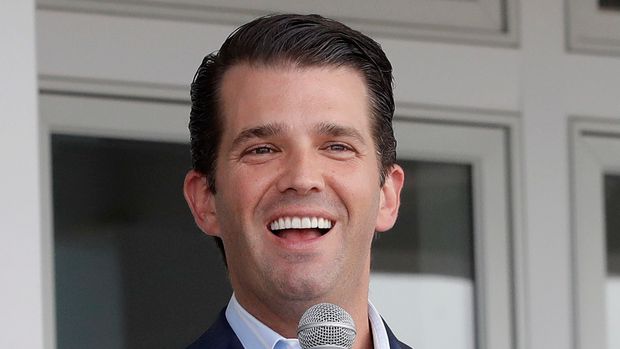 Eric Trump, left, and his brother Donald Trump Jr. talk at the opening of a Trump Golf Links clubhouse, Monday, June 11, 2018, in the Bronx borough of New York. President Donald Trump's two adult sons are cutting the ribbon on a clubhouse at the Trump Golf Links in the Bronx on Monday with hopes it will attract more visitors. Data from the city obtained in a Freedom of Information request by The Associated Press show revenue at the course fell 7 percent last year versus the year earlier. (AP Photo/Mark Lennihan)