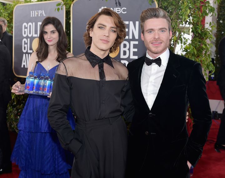 Kelleth in the background of Cody Fern and Richard Madden's photo