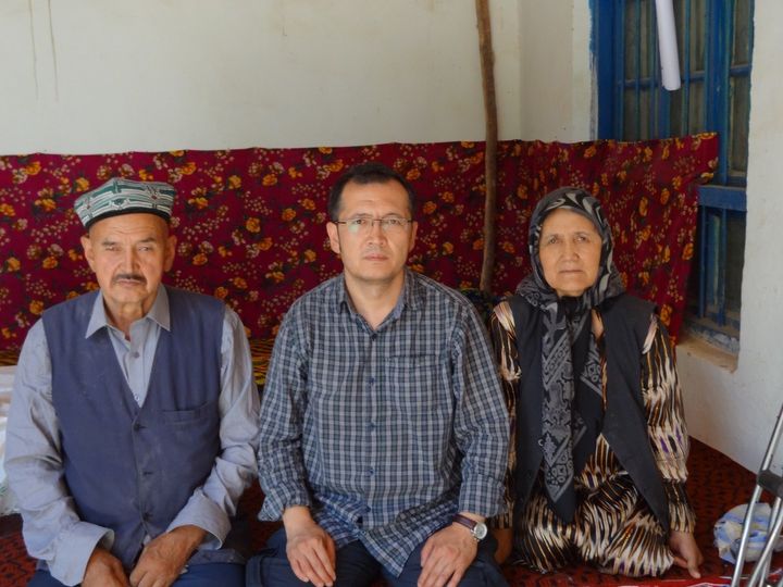 Aziz Isa Elkun with his parents in his village of Toyboldi in Xinjiang province, China. 