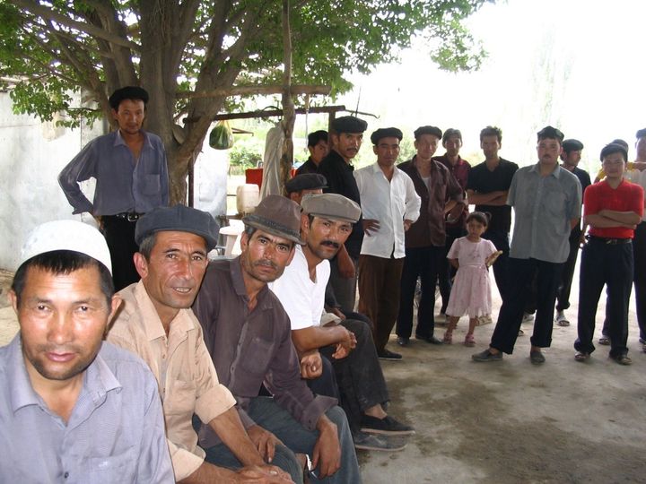 Elkun with fellow Uyghur villagers in Toyboldi, Shayar County, China. He fears his whole village has been interned by China