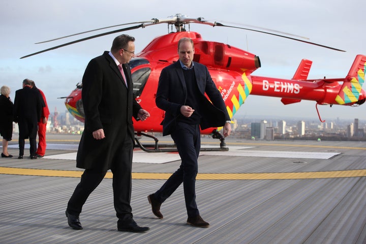 The Duke of Cambridge walks across the helipad after arriving in a red London Air Ambulance at the Royal London Hospital in east London on Jan. 9. 