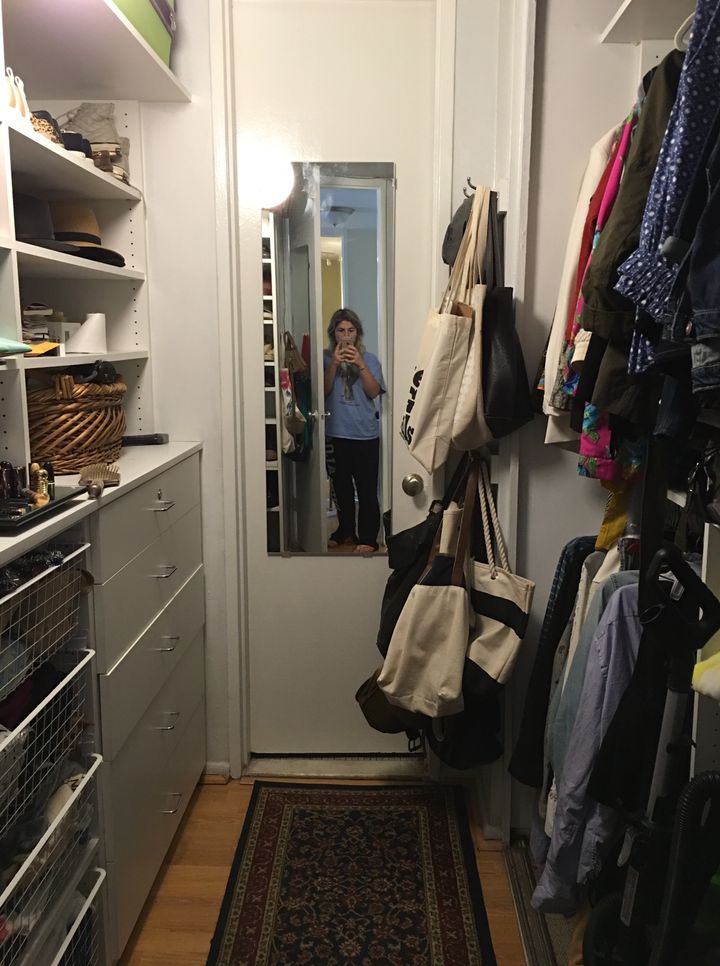 The author in her closet in 2016. Notice the amount of tote bags. 