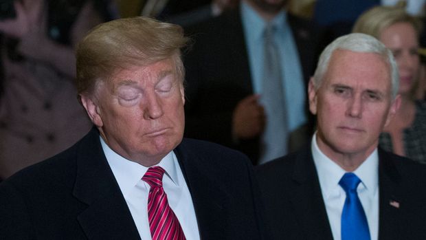 President Donald Trump, accompanied by Vice President Mike Pence, listens to a question as he arrives for a Senate Republican Policy luncheon, on Capitol Hill in Washington, Wednesday, Jan. 9, 2019. (AP Photo/Alex Brandon)