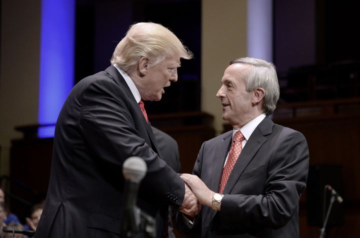 President Donald Trump is greeted by Pastor Robert Jeffress during a rally on July 1, 2017, in Washington, D.C.