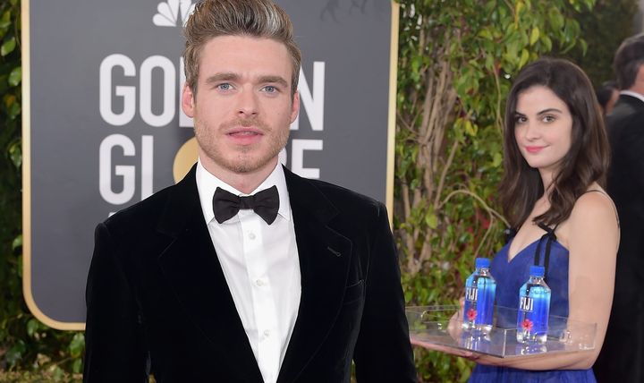 Model Kelleth Cuthbert became known as Fiji Water Girl after her expert photobombing at the Golden Globes took Twitter by storm. Here she shares a shot with Richard Madden.