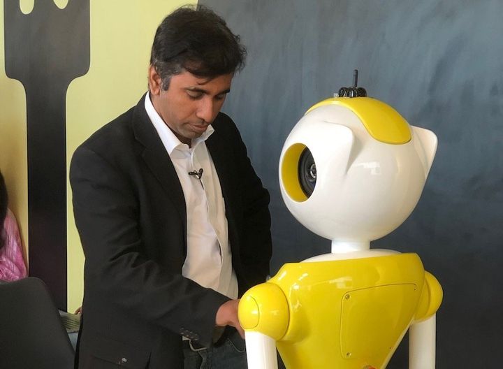 Balaji Viswanathan, CEO Invento Robotics, entering some data on the Mitri robot.