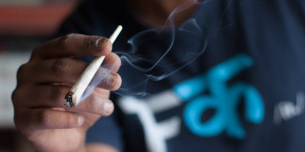 White turned brown in the heat of the flame. The cigarette collapsed in the center and tobacco crumbled...