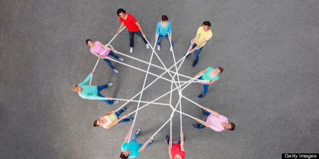 People playing with tangled string