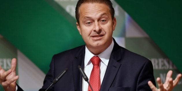 Former Pernambuco State governor Eduardo Campos, candidate of the Brazilian Socialist Party (PSB) for October's presidential election, speaks with businessmen at the National Agriculture Confederation headquarters in Brasilia, on August 6, 2014. Campos will face Brazil's President Dilma Rousseff, candidate of the Workers' Party (PT) and Senator Aecio Neves, candidate of the Brazilian Social Democratic Party (PSDB). AFP PHOTO/EVARISTO SA (Photo credit should read EVARISTO SA/AFP/Getty Images)