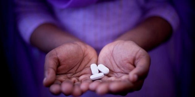 NASIK, MAHARASHTRA, INDIA - 2011/02/07: A woman holds anti-retroviral drugs for HIV / AIDS in the Yash Foundation, an NGO based in the city of Nashik. The drugs are free from the Indian state but after a while the virus can become resistant to drugs. The more exclusive drugs on the market are expensive and are not free and most people who are HIV positive will never be able to afford to take advantage of them. Critics and NGO workers claim that the Indian government is hiding the fact that the country is facing an epidemic, and nobody really knows how many people are infected with the virus.. (Photo by Jonas Gratzer/LightRocket via Getty Images)