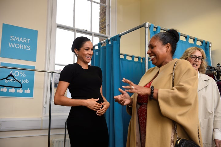 The Duchess of Sussex picks out clothes with Patsy Wardally during her visit to Smart Works, a charity to which she has become patron, at St. Charles hospital in west London.