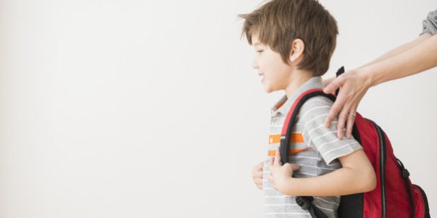 Hispanic mother rushing son to school