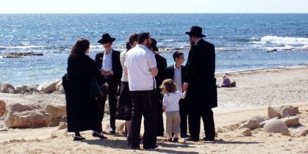 A Jewish family visiting the remains of the Ceasarea aquaduct, Israel