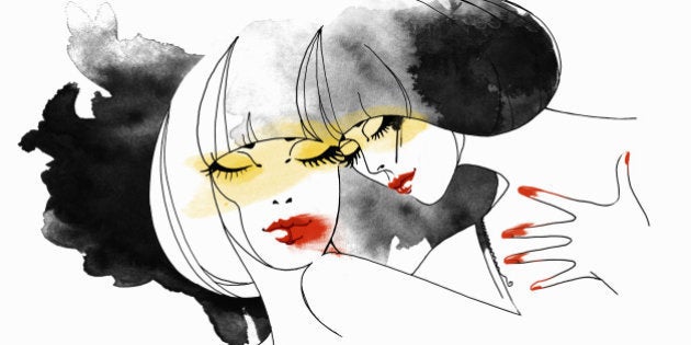 Twin women embracing posing as astrology sign Gemini