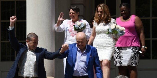 New York City Mayor Bill de Blasio officiate the marriages of (L-R) Terrence McNally and Thomas Kirdahy, Denise Niewinski and Cindy Jackson, and Sarah Joseph and Katrina Council on the steps of City Hall, New York on June 26, 2015. They will make history as the woman are the first couples to exchange their vows with marriage equality as the law of not just our state, but of the entire country. the Supreme Court ruled 5-4 that same-sex marriage be made legal nationwide. AFP PHOTO / TIMOTHY A. CLARY (Photo credit should read TIMOTHY A. CLARY/AFP/Getty Images)