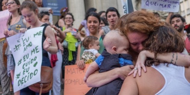 Brazilian women demonstrate in favor of abort legalization and against the president of the Brazilian Chamber of Deputies, Eduardo Cunha, in Rio de Janeiro downtown on November 11, 2015.AFP PHOTO / CHRISTOPHE SIMON (Photo credit should read CHRISTOPHE SIMON/AFP/Getty Images)