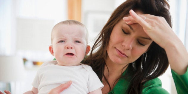 USA, New Jersey, Jersey City, Tired mother holding baby daughter (6-11 months)