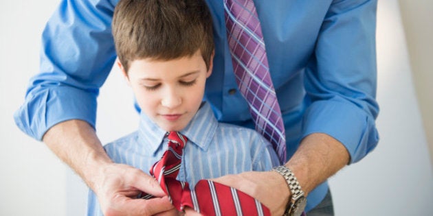 USA, New Jersey, Jersey City, Father adjusting son's (8-9) tie