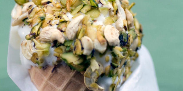 DAMASCUS, SYRIA - 2010/03/30: Pistachio rolled ice-cream at Bakdash inside Souk al-Hamidiyeh in the Old Town of Damascus, Syria. This ice-cream shop is an institution in Damascus. (Photo by Leisa Tyler/LightRocket via Getty Images)