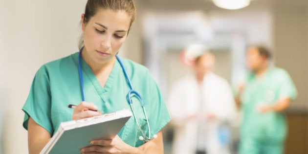 USA, New Jersey, Jersey City, Female doctor in hospital hallway