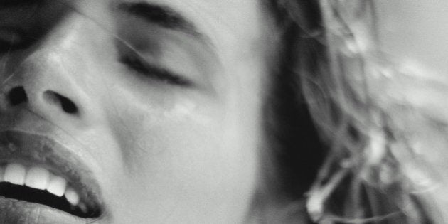 Woman with eyes closed, close-up (B&W)
