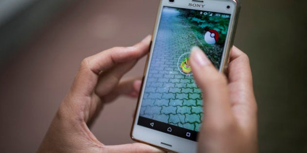 REICHENBACH, GERMANY - AUGUST 01: A woman plays the smartphone game Pokemon Go on August 01, 2016 in Reichenbach/OL, Germany. (Photo by Florian Gaertner/Photothek via Getty Images)
