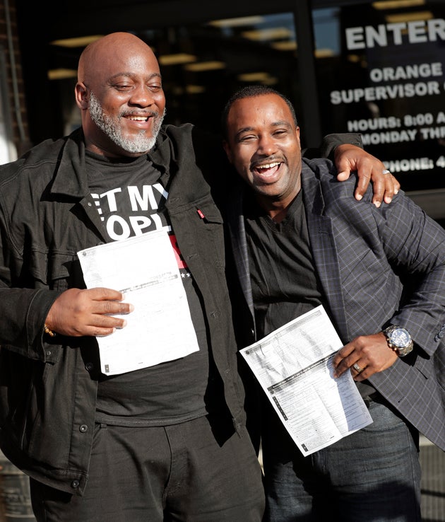 Former felons Desmond Meade, president of the Florida Rights Restoration Coalition, left, and David Ayala,...