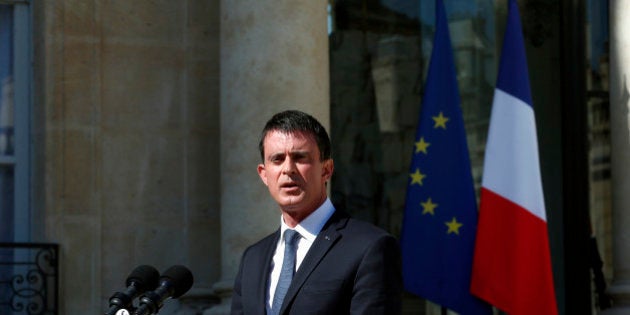 French Prime Minister Manuel Valls speaks to media after a security meeting at the Elysee Palace, in Paris, Friday, July 15, 2016. Prime Minister Valls said the government is declaring three days of national mourning after the attack in Nice. Speaking after an emergency meeting, Valls said the national mourning would begin Saturday. (AP Photo/Thibault Camus)
