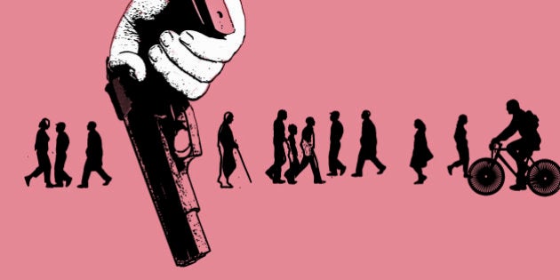 Members of the public unaware of man holding gun