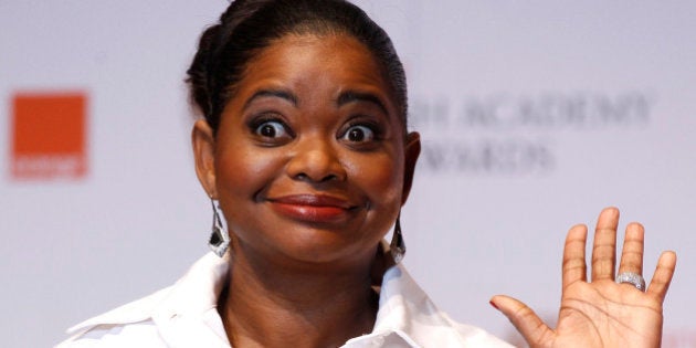 Actress Octavia Spencer celebrates after winning the award for Supporting Actress for