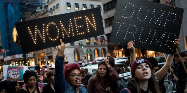 NEW YORK, NY - NOVEMBER 3: A group of protestors, comprised mostly of women, rally against Republican presidential candidate Donald Trump outside of Trump Tower, November 3, 2016 in New York City. Election Day is less than a week away in the United States, where citizens will choose between Donald Trump and Hillary Clinton to become the next president. (Photo by Drew Angerer/Getty Images)