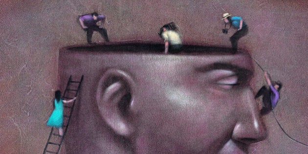 People Looking in Man's Head