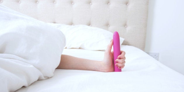 Female holding Dildo vibrator
