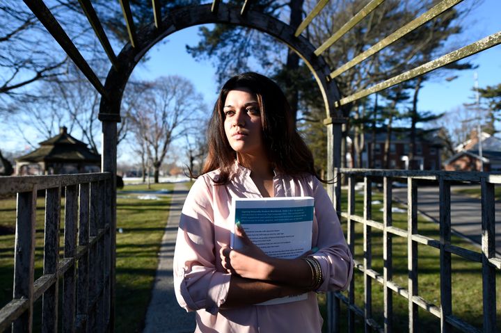 In this Feb. 2, 2016, file photo, Naila Amin, 26, attends class at Nassau Community College in Garden City, N.Y. “My passport ruined my life,” said Amin, a dual citizen from Pakistan who grew up in New York City. She was forcibly married at 13 in Pakistan and applied for papers for her 26-year-old husband to come to the country. 