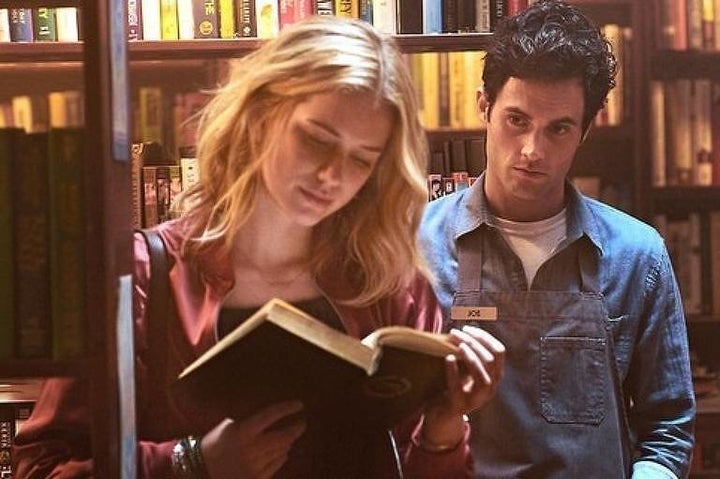 Penn Badgley and Elizabeth Lail in the Lifetime series "You," which is now streaming on Netflix. 