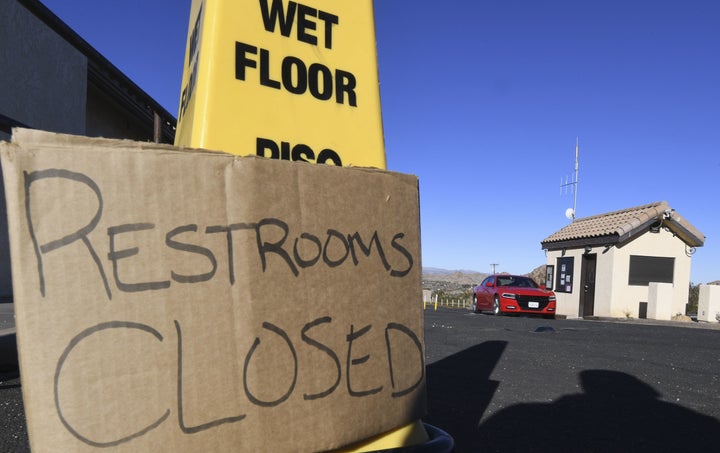 Tourists drive past the closed entrance ticket station of California's Joshua Tree National Park on Jan. 3.