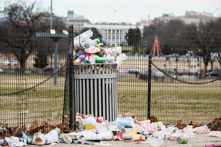 Garbage overflows from a trash can on the National Mall across from the White House on Jan. 1, 2019.