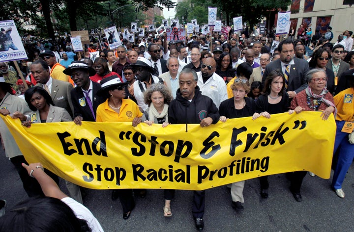 In this June 17, 2012, file photo, the Rev. Al Sharpton, center, walks with demonstrators during a silent march to end New Yo