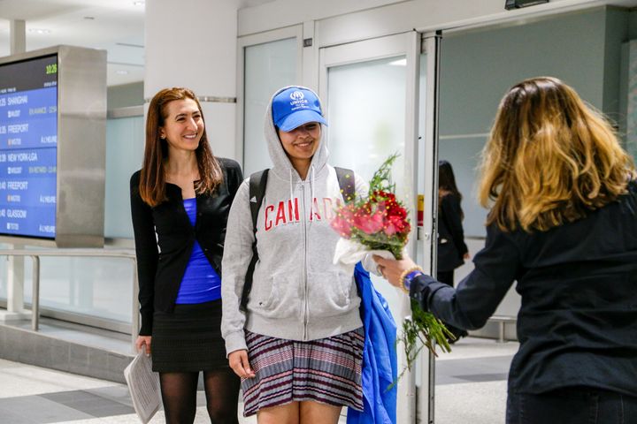Rahaf Mohammed al-Qunun, centre, arrived at Toronto’s Pearson International Airport on Saturday morning.