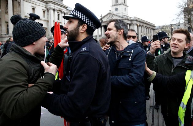 Owen Jones, far right in this picture, was escorted by police as he attended an anti-cuts demo in London on Saturday.