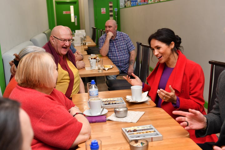 The Duchess of Sussex speaks with local people at Number 7, a "Feeding Birkenhead" citizens supermarket and community cafe, at Princess Pavements, Pyramids Shopping Centre.