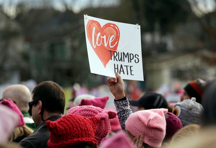 A protester in Seattle holds up a sign before a Women’s March of tens of thousands on Jan. 21, 2017.