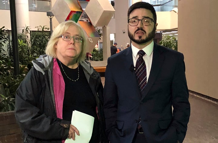 Deitra Ennis, left, and Ryan Stuart, attorneys with the city of Anchorage, talk to reporters after a hearing in federal court Friday. They represent the city in a federal lawsuit filed by a faith-based shelter over a local requirement that it accept transgender women.